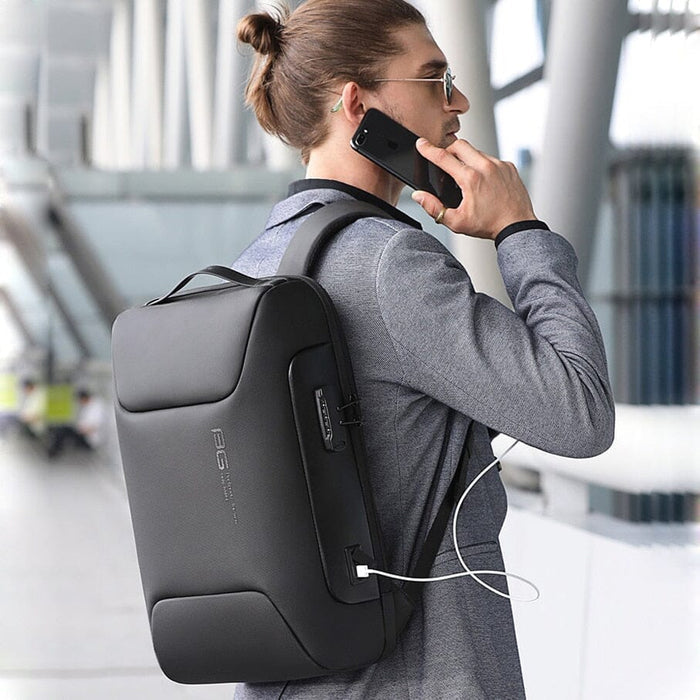 Mochila Executiva Rauffstein RS401 moderna, com tecido impermeável, porta USB e trava TSA, perfeita para notebook 15" em viagens ou trabalho.